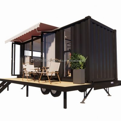 Casa de contenedores de mini móvil moderno con marco de acero de acero galvanizado y ruedas de material de paneles de sándwich