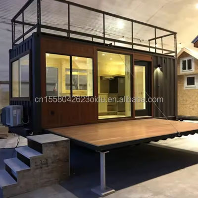 Contenedor de paquete plano de 20 pies de diseño moderno de acero prefabricado para el hogar móvil Bar de café con terraza y aplicación al aire libre