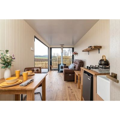 Casa de contenedores de envío de lujo moderna prefabricada Villa de 40 pies Un dormitorio Una cocina Un baño Un salón para la tienda