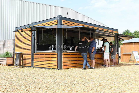 Tienda de contenedores de 20 pies Cuadro de madera de grano de metal Hotel Casa móvil con tubos cuadrados de acero galvanizado y embalaje plano